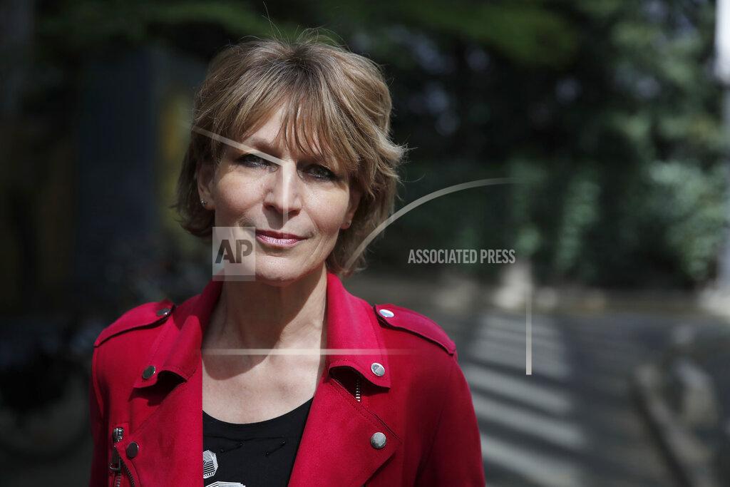 Christophe Ena Amnesty International Secretary General Agnes Callamard poses in Paris, Tuesday, April 6, 2021. Agnes Callamard is best known for her investigation into the killing of Saudi journalist Jamal Khashoggi, and has made a career uncovering extra-judicial killings. The French human rights expert's focus on rights abuses is taking on new dimensions as she assumes leadership of Amnesty International and turns her attention to what she says is one of the world's most pressing rights issues — vaccine equity. (AP Photo/Christophe Ena)