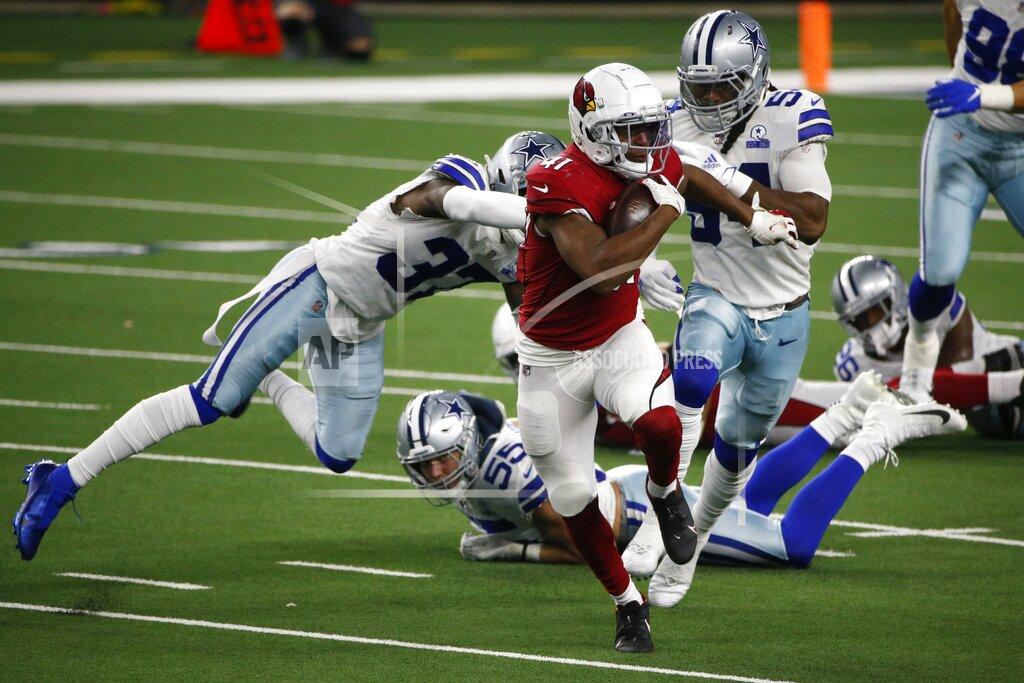 Michael Ainsworth Arizona Cardinals running back Kenyan Drake (41) breaks past Dallas Cowboys' Donovan Wilson (37), Leighton Vander Esch (55) and Jaylon Smith (54) for a long run in the second half of an NFL football game in Arlington, Texas, Monday, Oct. 19, 2020. (AP Photo/Michael Ainsworth)
