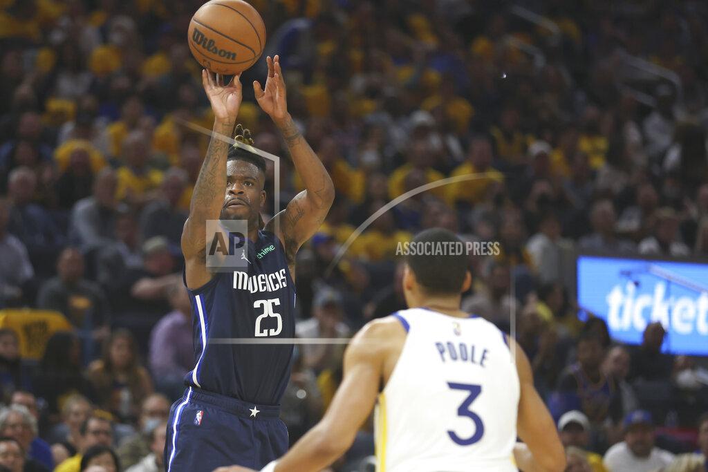 Jed Jacobsohn Dallas Mavericks forward Reggie Bullock (25) shoots against Golden State Warriors guard Jordan Poole (3) during the first half of Game 2 of the NBA basketball playoffs Western Conference finals in San Francisco, Friday, May 20, 2022. (AP Photo/Jed Jacobsohn)