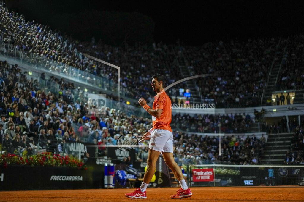 Andrew Medichini Novak Djokovic of Serbia celebrates after winning a point to Felix Auger-Aliassime of Canada during their match at the Italian Open tennis tournament, in Rome, Friday, May 13, 2022. (AP Photo/Andrew Medichini)