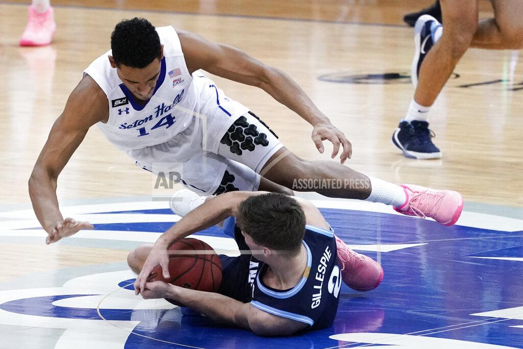 Mary Altaffer Seton Hall guard Jared Rhoden (14) and Villanova guard Collin Gillespie (2) fight for the ball during the second half of an NCAA college basketball game, Saturday, Jan. 30, 2021, in Newark, N.J. (AP Photo/Mary Altaffer)