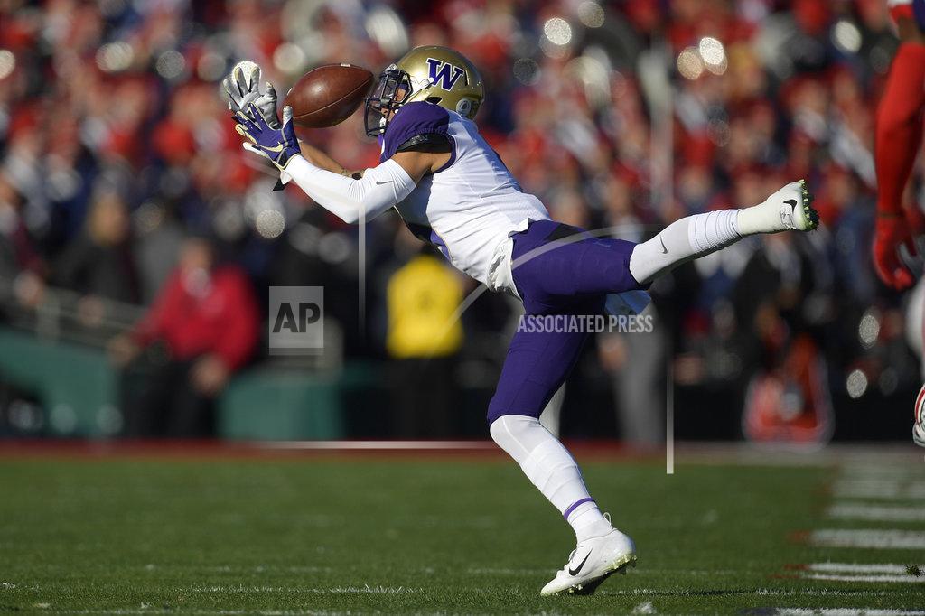 Mark J. Terrill Washington wide receiver Andre Baccellia can't hang onto a pass during the first half of the Rose Bowl NCAA college football game against Ohio State, Tuesday, Jan. 1, 2019, in Pasadena, Calif. (AP Photo/Mark J. Terrill)