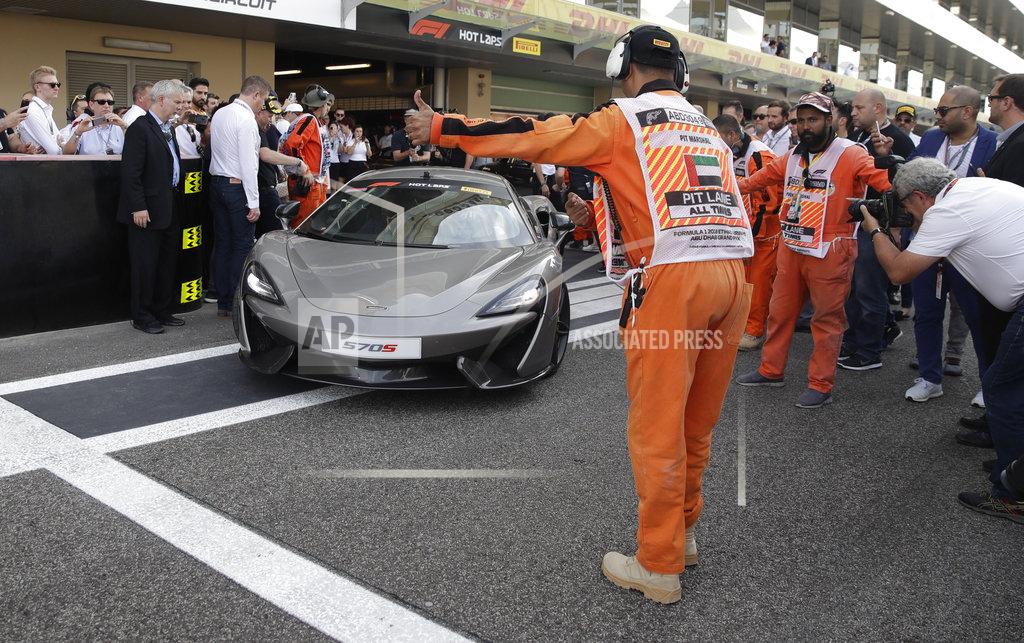 Racing greats Alonso and Johnson drive together in Abu Dhabi
