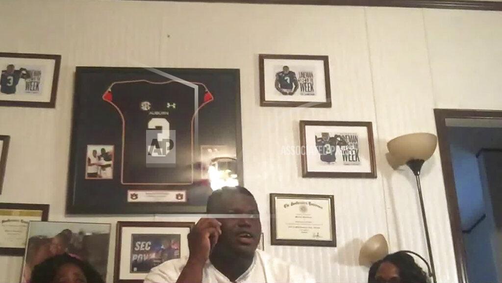 In this still image from video provided by the NFL, Marlon Davidson talks on the phone and is selected by the Atlanta Falcons during the second round of the NFL football draft, Friday, April 24, 2020. (NFL via AP)