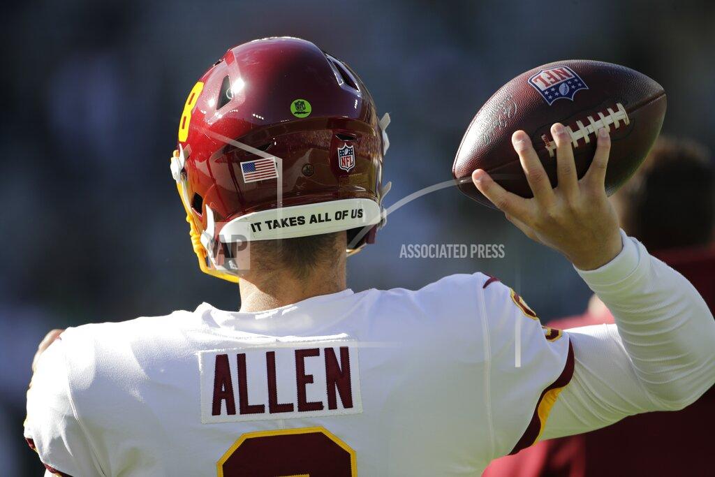Aaron Gash Washington Football Team's Kyle Allen warms up before an NFL football game against the Green Bay Packers Sunday, Oct. 24, 2021, in Green Bay, Wis. (AP Photo/Aaron Gash)