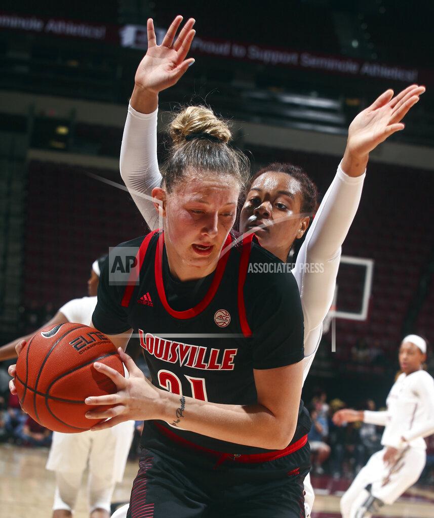 Phil Sears Louisville forward Kylee Shook (21) tries to get out of the corner as Florida State forward Valencia Myers, back, defends during the fourth quarter of an NCAA college basketball game in Tallahassee, Fla., Thursday, Jan. 24, 2019. (AP Photo/Phil Sears)