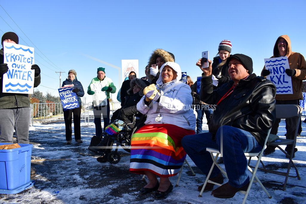 Matthew Brown FILE - In this Oct. 29, 2019 file photo, opponents of the Keystone XL oil pipeline from Canada demonstrate in sub-freezing temperatures in Billings, Mont. Alberta is investing $1.1 billion in the disputed Keystone XL pipeline, a project that Alberta Premier Jason Kenney says is crucial for the province's economy. (AP Photo/Matthew Brown, File)