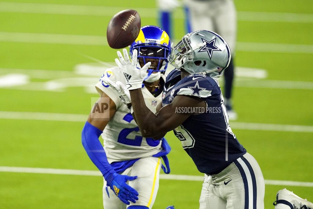 Ashley Landis Dallas Cowboys wide receiver Michael Gallup, right, makes a catch but is called for offensive pass interference on Los Angeles Rams' Jalen Ramsey during the second half of an NFL football game Sunday, Sept. 13, 2020, in Inglewood, Calif. (AP Photo/Ashley Landis)