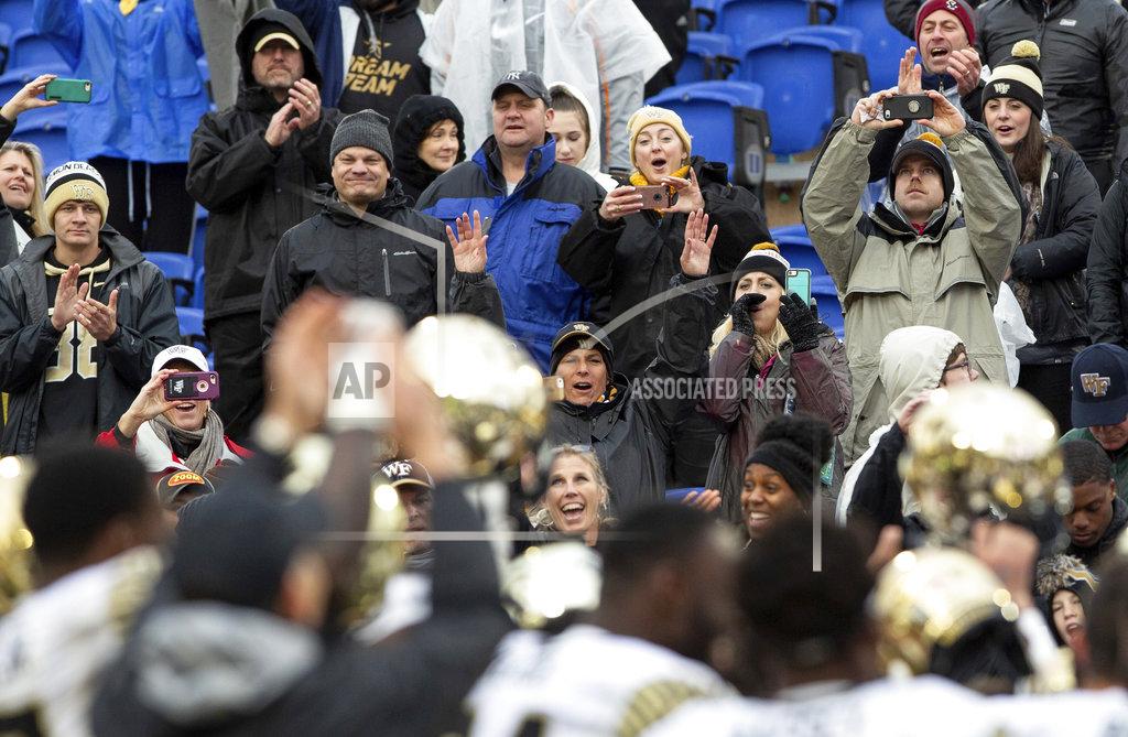 Ben Mckeown Wake Forest fans celebrate with players following a 59-7 victory over Duke in an NCAA college football game in Durham, N.C., Saturday, Nov. 24, 2018. (AP Photo/Ben McKeown)