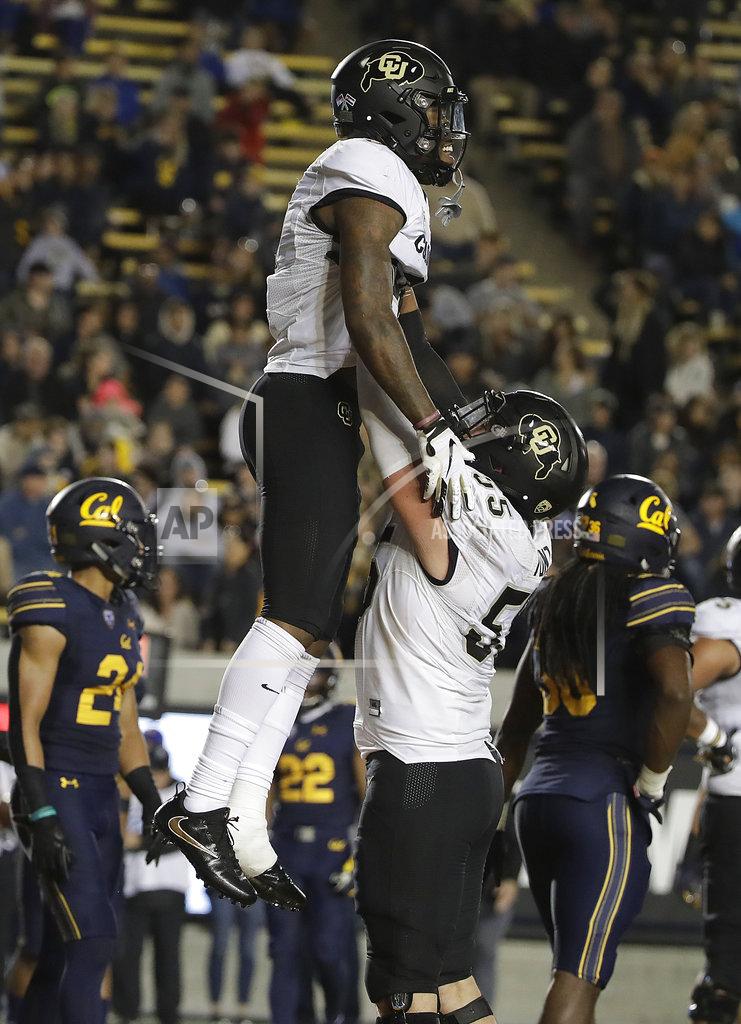 Jeff Chiu Colorado wide receiver Juwann Winfree, top, celebrates with offensive lineman Brett Tonz after scoring against California during the second half of an NCAA college football game in Berkeley, Calif., Saturday, Nov. 24, 2018. California won, 33-21. (AP Photo/Jeff Chiu)