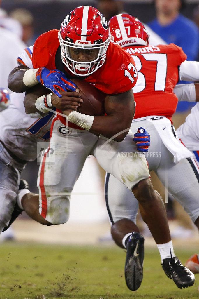 Joshua L. Jones Georgia tailback Elijah Holyfield (13) moves the rock during the second half of an NCAA college football game between Georgia and Florida at in Jacksonville, Fla. Saturday, Oct. 27, 2018. (Joshua L. Jones/Athens Banner-Herald via AP)