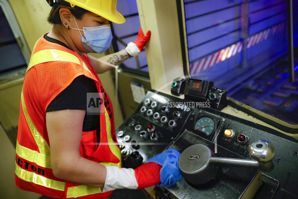 John Minchillo A contractor cleans a subway car at the 96th Street station to control the spread of COVID-19, Thursday, July 2, 2020, in New York. Mass transit systems around the world have taken unprecedented — and expensive — steps to curb the spread of the coronavirus, including shutting down New York subways overnight and testing powerful ultraviolet lamps to disinfect seats, poles and floors. (AP Photo/John Minchillo)