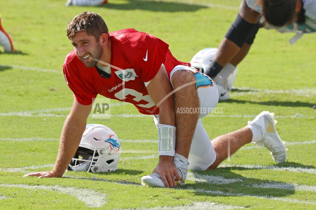 Miami Dolphins quarterback Josh Rosen (3) stretches during an NFL football training camp practice in Davie, Fla., Tuesday, Sept. 1, 2020. (AP Photo/Joel Auerbach)