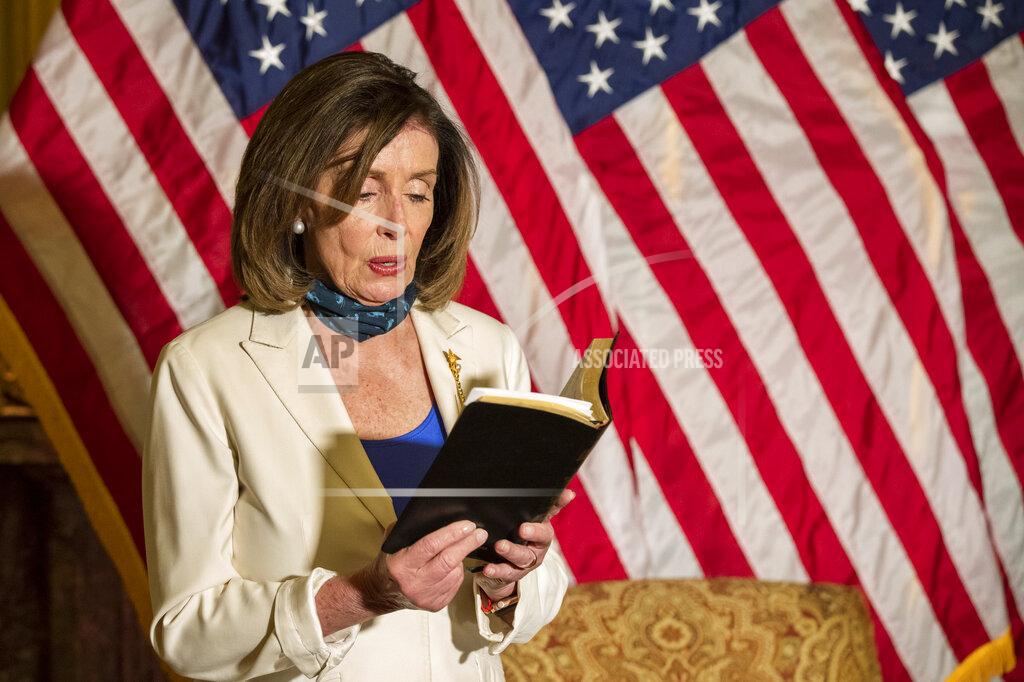 Manuel Balce Ceneta House Speaker Nancy Pelosi of Calif., reads from the Bible, as she reacts to President Donald Trump during a news conference at the U.S. Capitol in Washington, Tuesday, June 2, 2020. (AP Photo/Manuel Balce Ceneta)