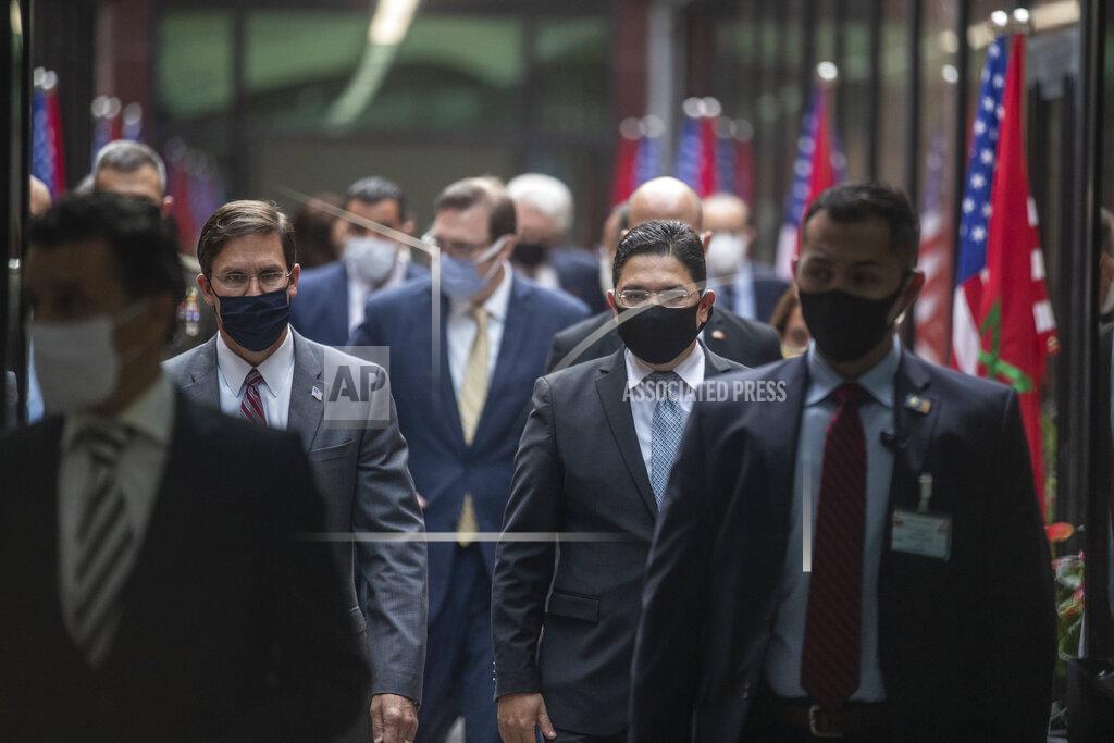 Mosa'ab Elshamy U.S Secretary of Defense Mark Esper, left, and Moroccan Foreign Minister Nasser Bourita, right, walk together during the former's visit to Rabat, Morocco, Friday, Oct. 2, 2020. The visit is part of U.S. Defense Secretary Mark Esper's North Africa tour and is his first visit to Africa as defense secretary. (AP Photo/Mosa'ab Elshamy)