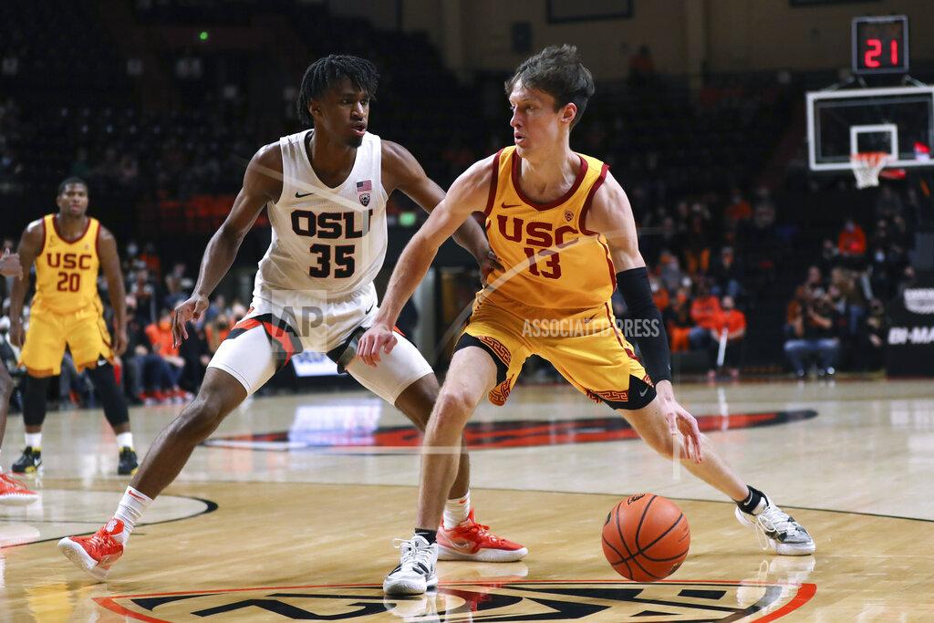 Amanda Loman Southern California guard Drew Peterson is defended by Oregon State forward Glenn Taylor Jr. during the second half of an NCAA college basketball game Thursday, Feb. 24, 2022, in Corvallis, Ore. Southern California won 94-91. (AP Photo/Amanda Loman)