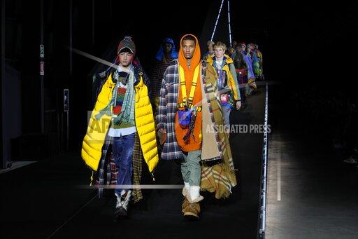 Models wear creations for the DSquared2 fall winter 22/23 collection, in Milan, Italy, Friday, Jan. 14, 2022. (AP Photo/Luca Bruno)