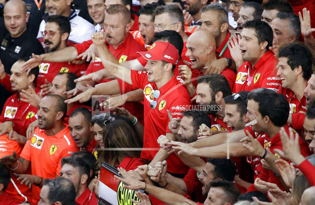 Luca Bruno Ferrari driver Charles Leclerc of Monaco celebrates after winning the Formula One Italy Grand Prix at the Monza racetrack, in Monza, Italy, Sunday, Sept.8, 2019. (AP Photo/Luca Bruno)