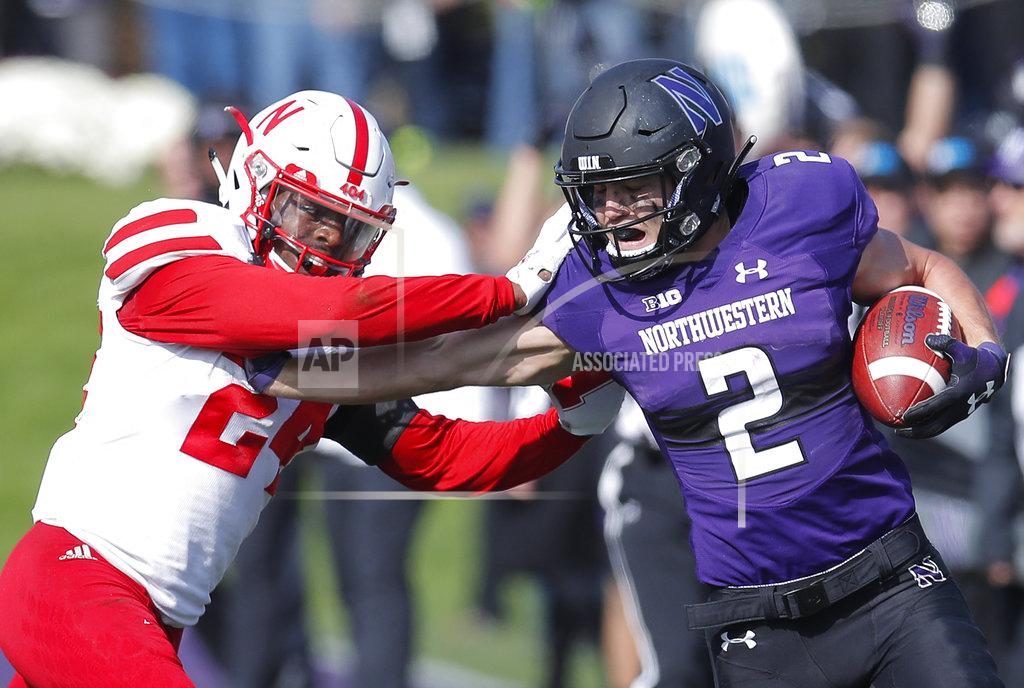 Jim Young Northwestern's Flynn Nagel, right, pushes off Nebraska's Aaron Williams during the second half of an NCAA college football game Saturday, Oct. 13, 2018, in Evanston, Ill.. (AP Photo/Jim Young)