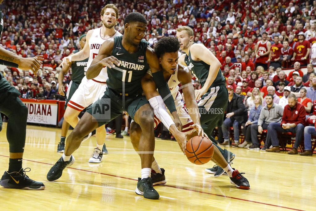 Darron Cummings Michigan State forward Aaron Henry (11) and Indiana forward Justin Smith (3) go for a loose ball in the first half of an NCAA college basketball game in Bloomington, Ind., Thursday, Jan. 23, 2020. (AP Photo/Darron Cummings)
