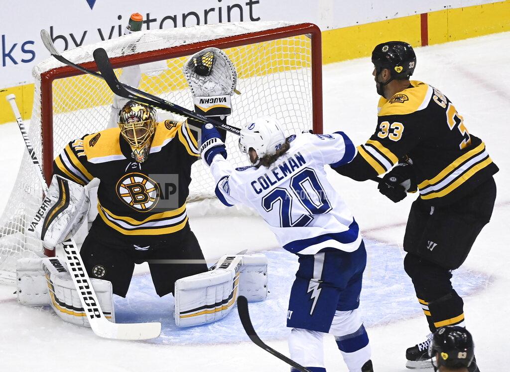 Nathan Denette Boston Bruins goaltender Tuukka Rask (40) makes a glove save as Tampa Bay Lightning center Blake Coleman (20) and Bruins defenseman Zdeno Chara (33) look on during the second period of an NHL Stanley Cup playoff hockey game in Toronto, Ontario, Wednesday, Aug. 5, 2020. (Nathan Denette/The Canadian Press via AP)