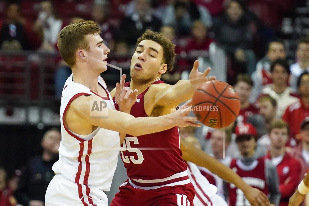 Andy Manis Wisconsin's Tyler Wahl (5) passes against Indiana's Race Thompson (25) during the first half of an NCAA college basketball game Saturday, Dec. 7, 2019, in Madison, Wis. (AP Photo/Andy Manis)