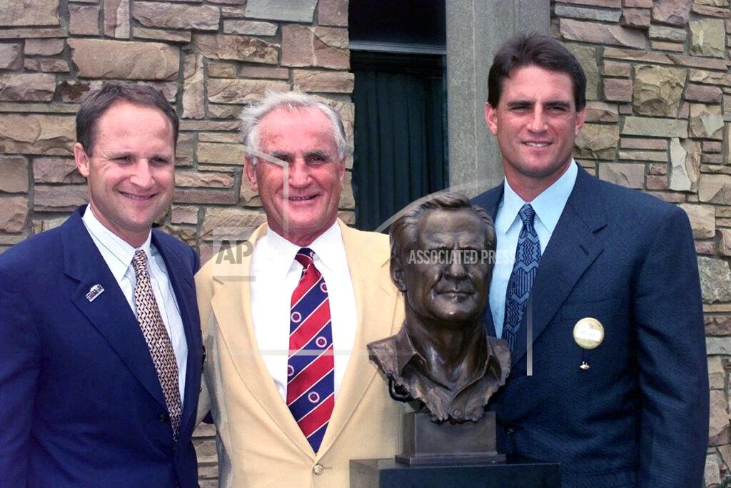 Mark Duncan FILE - In this July 26, 1997, file photo, Don Shula, center, stands with his sons David, left, and Mike after being enshrined into the Pro Football Hall of Fame in Canton, Ohio. Shula, who won the most games of any NFL coach and led the Miami Dolphins to the only perfect season in league history, died Monday, May 4, 2020, at his home in Indian Creek, Fla., the team said. He was 90. (AP Photo/Mark Duncan, File)