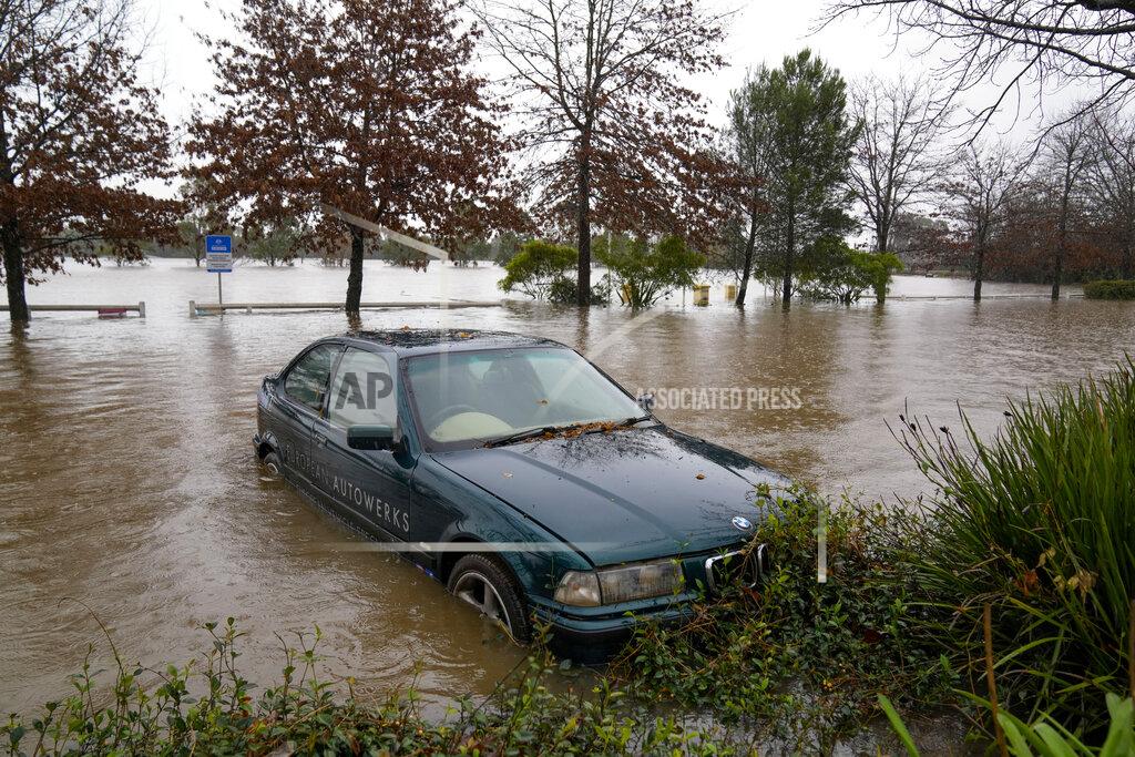 Mark Baker A car sits semi-submerged in flood waters at Camden on the outskirts of Sydney, Australia, Monday, July 4, 2022. More than 30,000 residents of Sydney and its surrounds have been told to evacuate or prepare to abandon their homes on Monday as Australia’s largest city braces for what could be its worst flooding in 18 months. (AP Photo/Mark Baker)