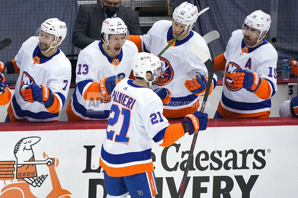 Gene J. Puskar New York Islanders' Kyle Palmieri (21) returns to the bench after scoring during the first period in Game 1 of an NHL hockey Stanley Cup first-round playoff series against the Pittsburgh Penguins in Pittsburgh, Sunday, May 16, 2021. (AP Photo/Gene J. Puskar)