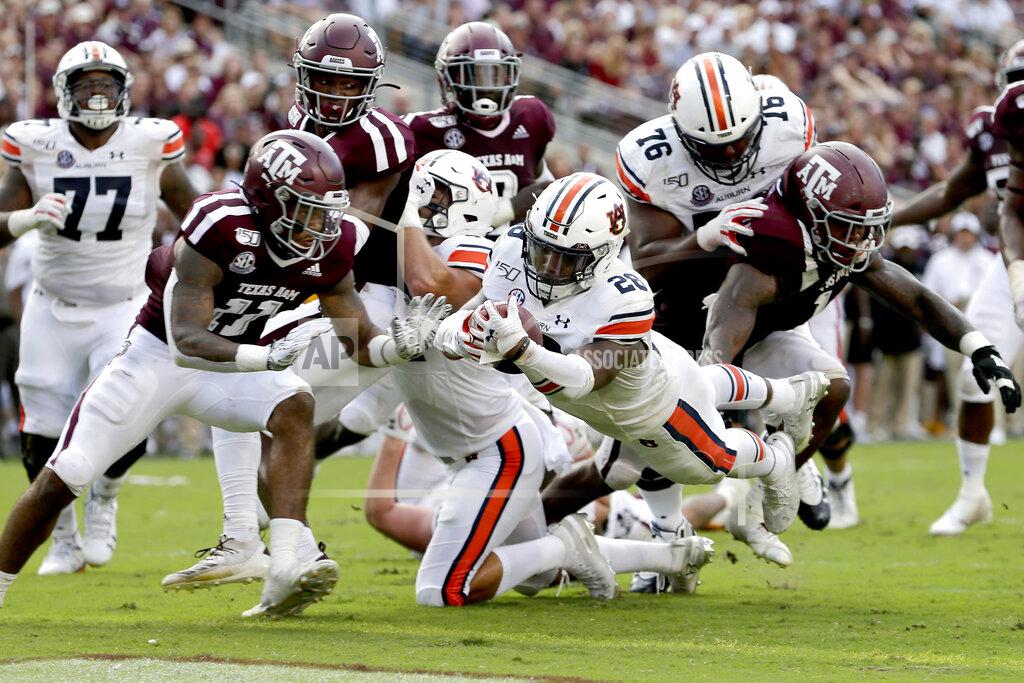 Sam Craft Auburn running back JaTarvious Whitlow (28) dives over the goal line for a touchdown against Texas A&M during the second half of an NCAA college football game, Saturday, Sept. 21, 2019, in College Station, Texas. (AP Photo/Sam Craft)