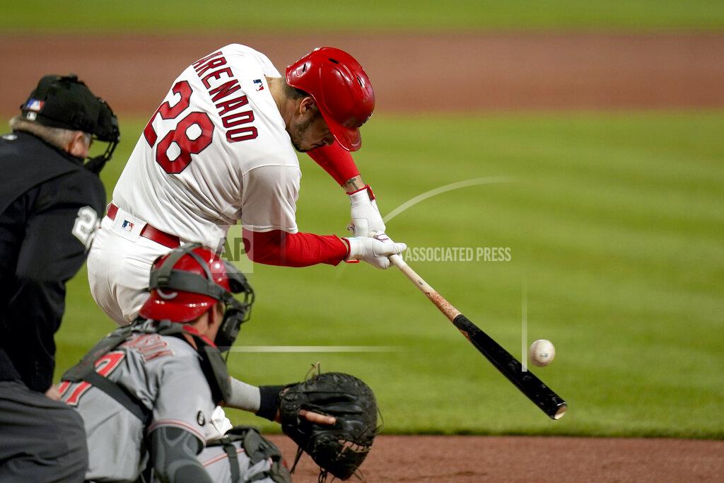 Jeff Roberson St. Louis Cardinals' Nolan Arenado (28) hits an RBI single during the third inning of a baseball game against the Cincinnati Reds Friday, April 23, 2021, in St. Louis. (AP Photo/Jeff Roberson)