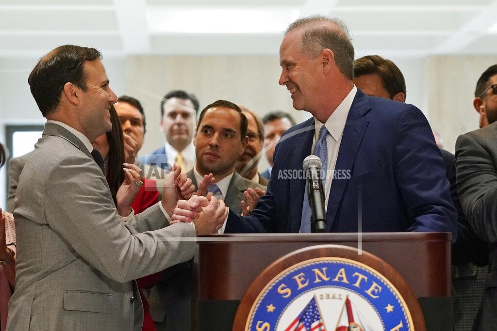 Wilfredo Lee Speaker of the House Chris Sprowls, left, and Senate President Wilton Simpson shake hands as they celebrate the end of a legislative session, Friday, April 30, 2021, at the Capitol in Tallahassee, Fla. (AP Photo/Wilfredo Lee)