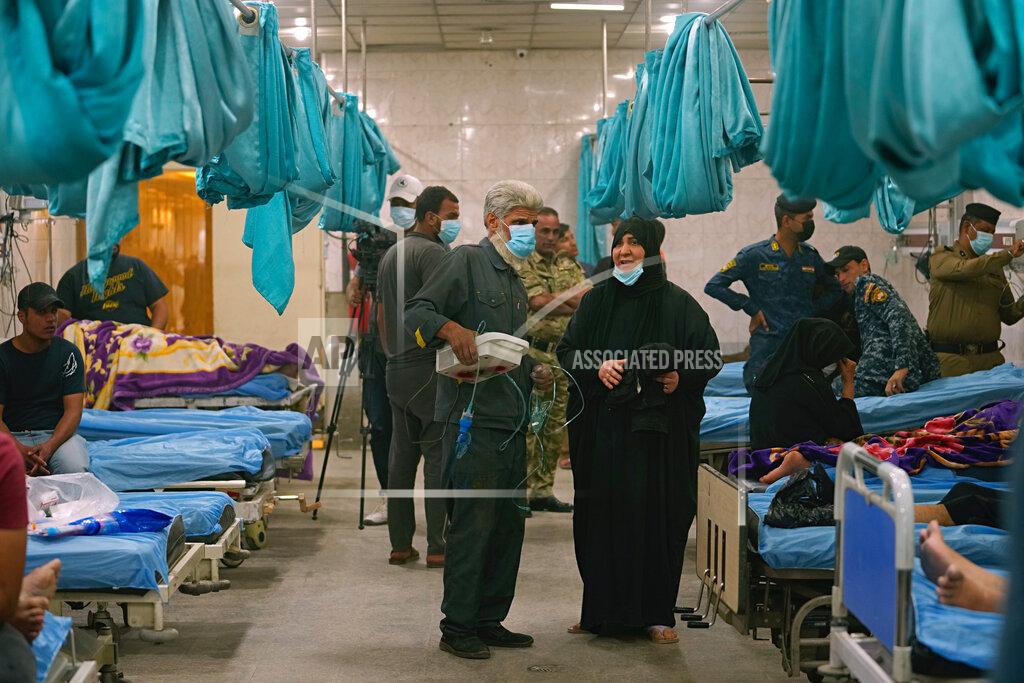 Hadi Mizban People with breathing problems are treated at a hospital during a sandstorm in Baghdad, Iraq, Monday, May 23, 2022. (AP Photo/Hadi Mizban)