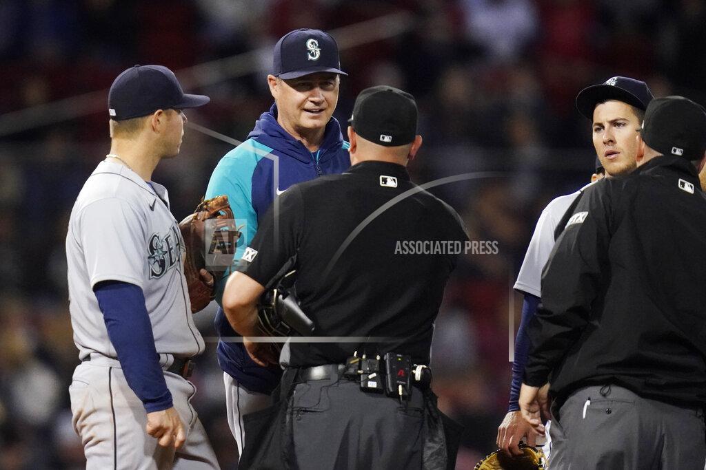 Charles Krupa Seattle Mariners manager Scott Servais talks with umpires during during a pitching change in the sixth inning of the team's baseball game against the Boston Red Sox at Fenway Park, Thursday, May 19, 2022, in Boston. (AP Photo/Charles Krupa)