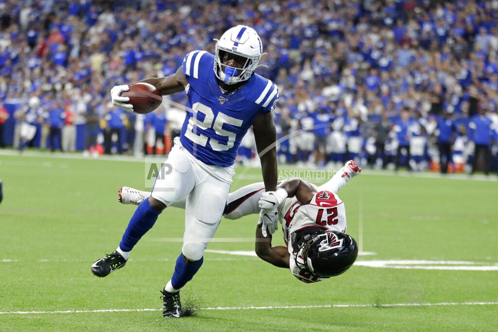 Michael Conroy Indianapolis Colts running back Marlon Mack (25) runs past Atlanta Falcons strong safety Damontae Kazee (27) for a touchdown during the second half of an NFL football game, Sunday, Sept. 22, 2019, in Indianapolis. (AP Photo/Michael Conroy)