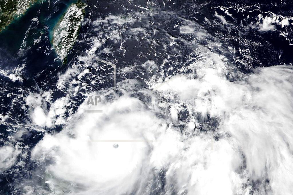 Uncredited This Friday, Sept, 10, 2021, satellite image released by NASA, shows Typhoon Chanthu, right, developing into a powerful typhoon moving towards Taiwan, top left. Chanthu continues gaining strength and is expected to make landfall in Taiwan over the weekend. (NASA Worldview, Earth Observing System Data and Information System (EOSDIS) via AP)