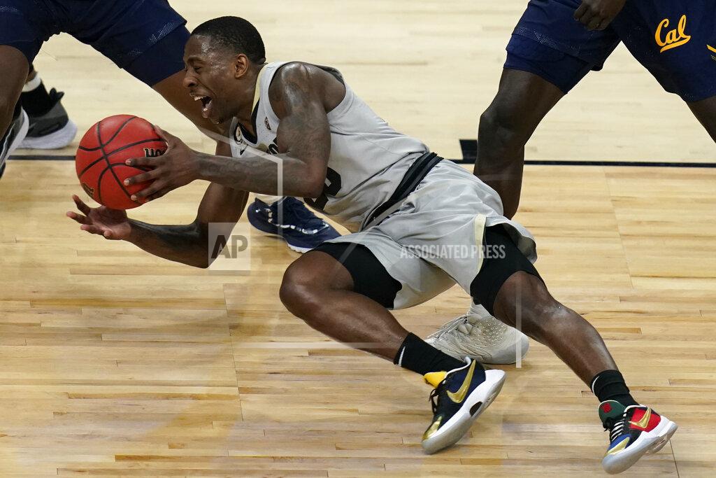 John Locher Colorado's McKinley Wright IV (25) falls while driving up the court against California during the second half of an NCAA college basketball game in the quarterfinal round of the Pac-12 men's tournament Thursday, March 11, 2021, in Las Vegas. (AP Photo/John Locher)