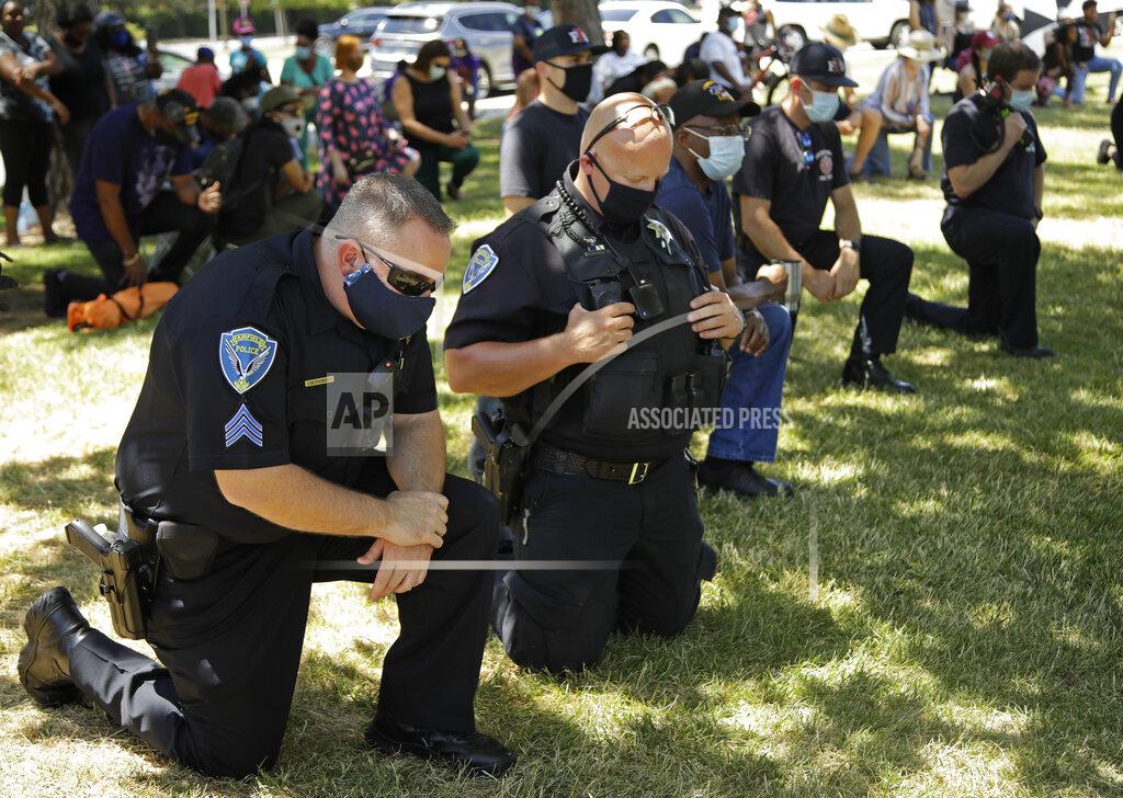 Ben Margot Fairfield police officers kneel during "Taking a knee for Justice and Prayer" service on Wednesday, June 3, 2020, in Fairfield, Calif. (AP Photo/Ben Margot)