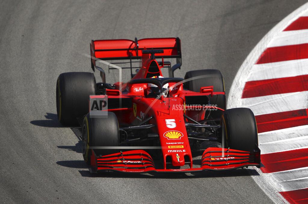 Ferrari driver Sebastian Vettel of Germany steers his car during the Formula One Grand Prix at the Barcelona Catalunya racetrack in Montmelo, Spain, Sunday, Aug. 16, 2020. (Bryn Lennon, Pool via AP)