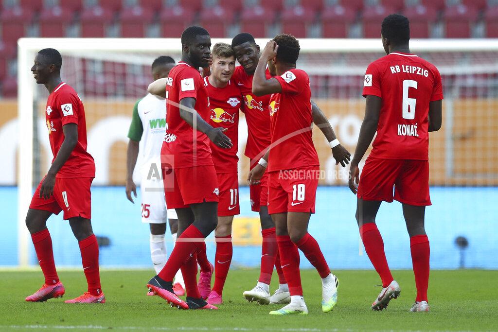 Matthias Schrader Leipzig's Timo Werner, center, celebrates with team mates after scoring his side's second goal during the German Bundesliga soccer match between FC Augsburg and RB Leipzig in Augsburg, Germany, Saturday, June 27, 2020. (AP Photo/Matthias Schrader, Pool)