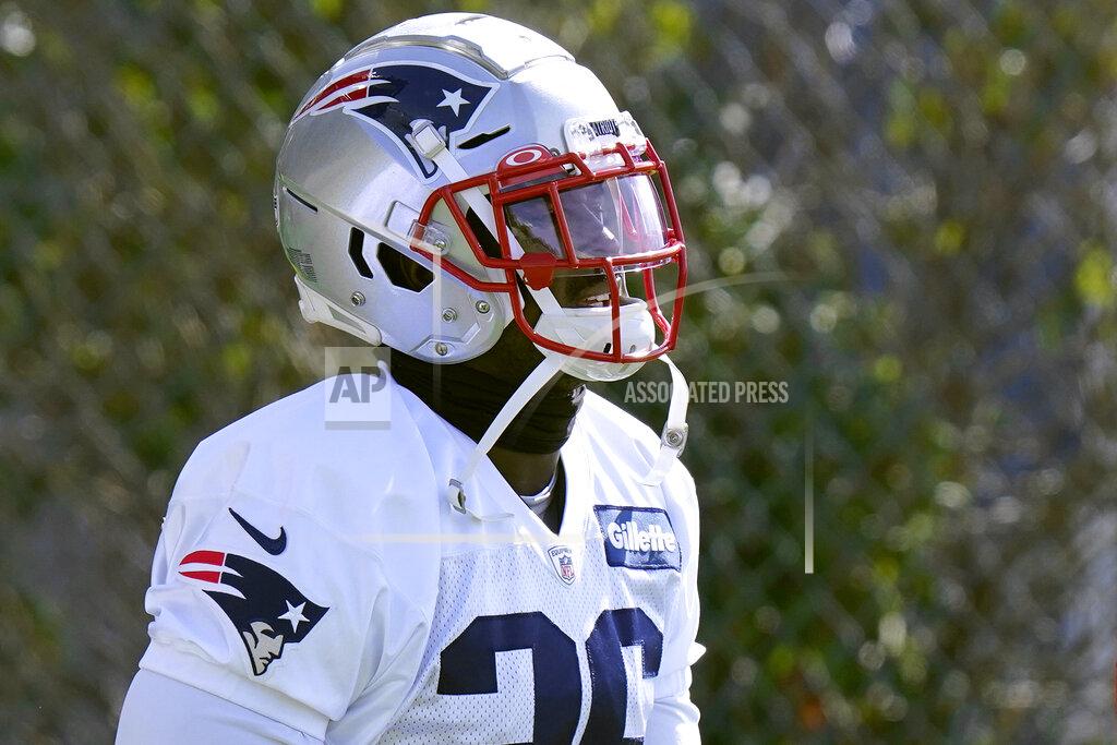 Steven Senne New England Patriots running back Sony Michel walks to the field for an NFL football training camp practice, Wednesday, Aug. 26, 2020, in Foxborough, Mass. (AP Photo/Steven Senne, Pool)