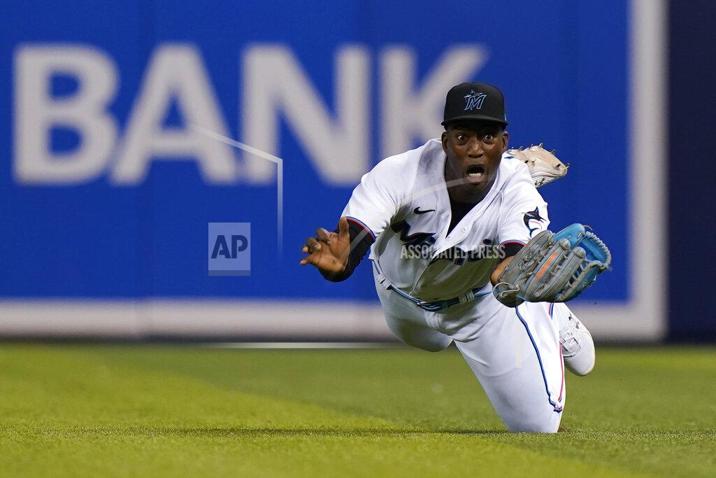 Wilfredo Lee Miami Marlins right fielder Jesus Sanchez makes a diving catch on a ball by New York Mets' Pete Alonso during the fourth inning of a baseball game Wednesday, Sept. 8, 2021, in Miami. (AP Photo/Wilfredo Lee)