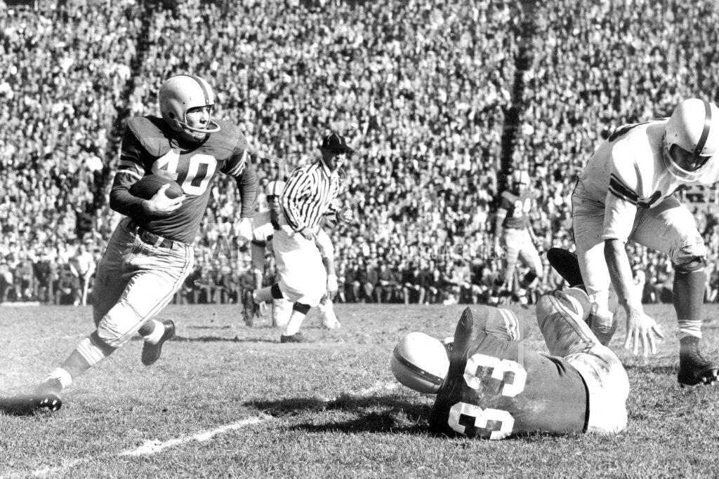 Uncredited FILE - In this Nov. 1955, file photo, Ohio State halfback Howard "Hopalong" Cassady (40) carries the ball against Indiana during a college football game in Columbus, Ohio. Cassady, a Heisman Trophy winner and former NFL running back, died early Friday, Sept. 20, 2019, in Tampa, Fla., Jerry Emig, the Ohio State associate athletic director said. He was 85. Cassady played both football and baseball at Ohio State in the early 1950s, winning the Heisman Trophy in 1955. He also played 10 seasons in the NFL, mostly with the Detroit, and got the nickname "Hopalong" from local sports writers after the black-hatted Western star of the 1950s. (AP photo)