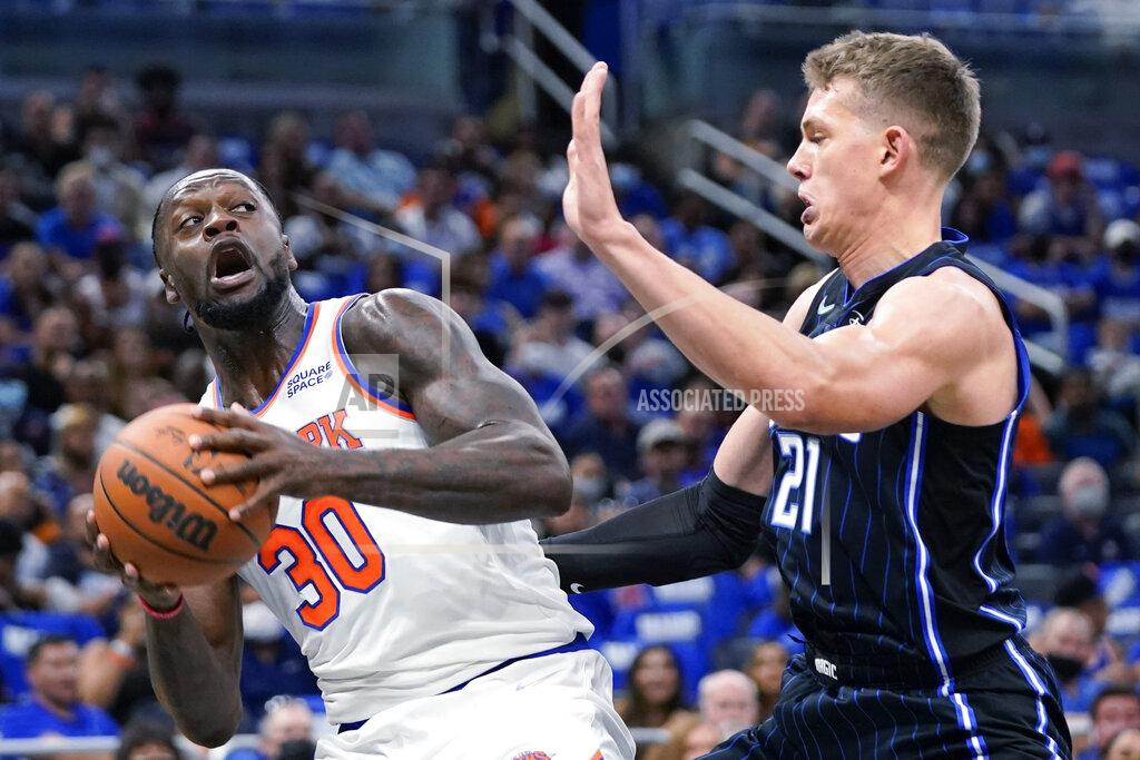 John Raoux New York Knicks' Julius Randle (30) looks for a way past Orlando Magic's Moritz Wagner during the first half of an NBA basketball game Friday, Oct. 22, 2021, in Orlando, Fla. (AP Photo/John Raoux)