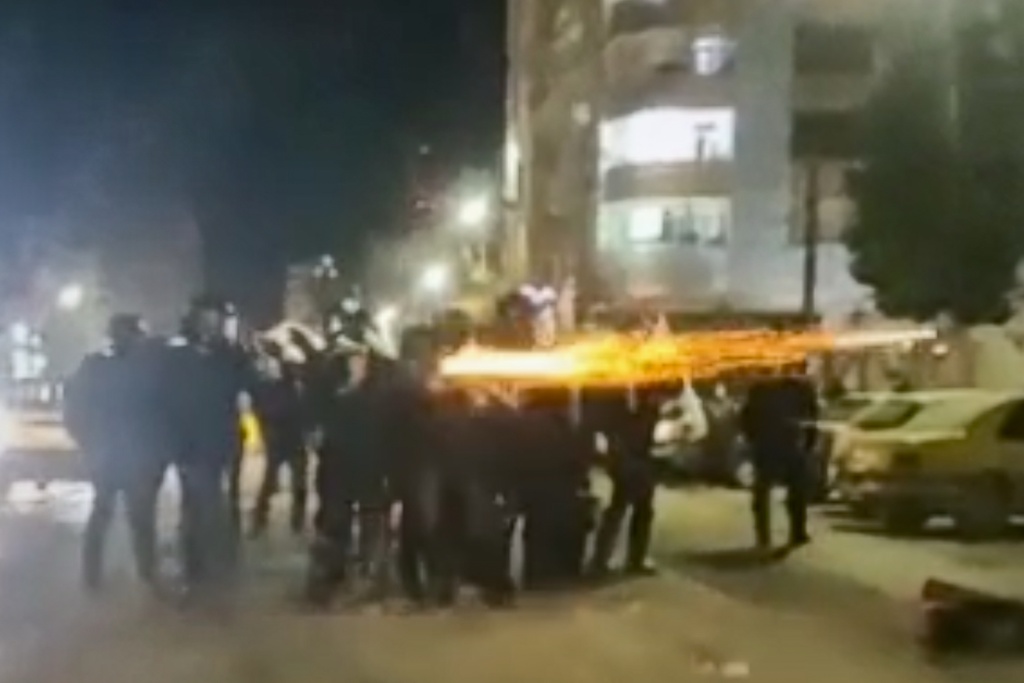 FILE - This image from a video verified by AP shows Iranian security forces shooting into the courtyard outside the Imam Khomeini Hospital, in Ilam, Iran, Jan. 4, 2026. (UGC via AP, File)