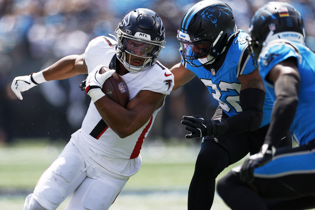 Atlanta Falcons running back Bijan Robinson runs against the Carolina Panthers during the first half of an NFL football game, Sunday, Sept. 21, 2025, in Charlotte, N.C. (AP Photo/Rusty Jones)