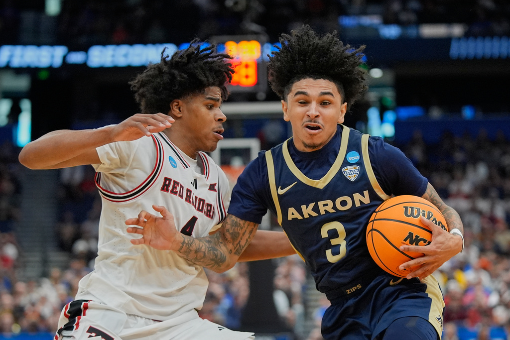 Akron guard Sharron Young (3) makes a move to get past Texas Tech guard Christian Anderson, left, during the first half in the first round of the NCAA college basketball tournament, Friday, March 20, 2026, in Tampa, Fla. (AP Photo/John Raoux)