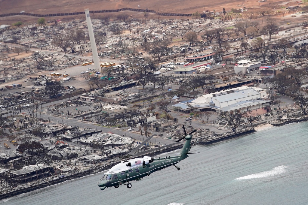 FILE - President Joe Biden and first lady Jill Biden take an aerial tour on Marine One over areas devastated by the Maui wildfires, Aug. 21, 2023, in Lahaina, Hawaii. (AP Photo/Evan Vucci, File)