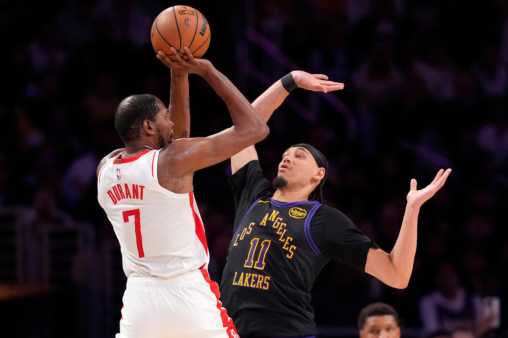 Houston Rockets forward Kevin Durant, left, shoots as Los Angeles Lakers center Jaxson Hayes defends during the second half in Game 2 of a first-round NBA playoffs basketball series Tuesday, April 21, 2026, in Los Angeles. (AP Photo/Mark J. Terrill)