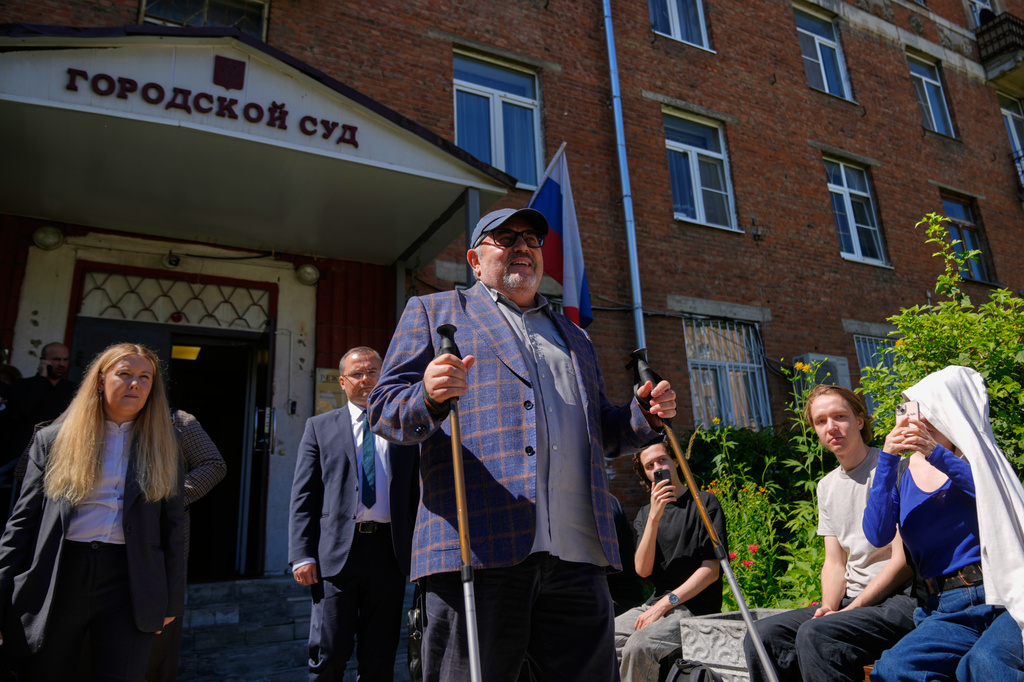 Russian politician Boris Nadezhdin, center, accused of displaying "extremist symbols," leaves a courtroom in the town of Dolgoprudny, outside Moscow, Russia, Friday, July 17, 2026. (AP Photo/Pavel Bednyakov)